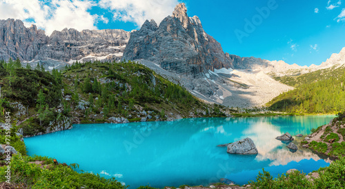 Panoramic view of Sorapis lake in Dolomites mountain, Italian Alps, Belluno, Italy. Alpine Lago di Sorapis with turquoise water near Cortina dAmpezzo. Summer vacation destination