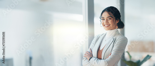 Happy, face and woman with arms crossed in office with business pride and corporate work. Smile, company and portrait of a female employee with confidence and professional empowerment at an agency photo