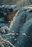 A beautiful waterfall in the midst of a snowy forest. Ideal for nature and winter-themed projects