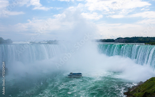 Fototapeta Naklejka Na Ścianę i Meble -  Peasure boat with tourists near Niagara Falls