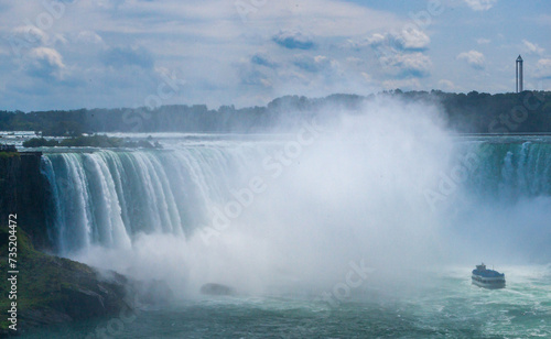 Peasure boat with tourists near Niagara Falls