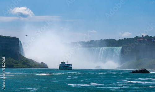 Peasure boat with tourists near Niagara Falls