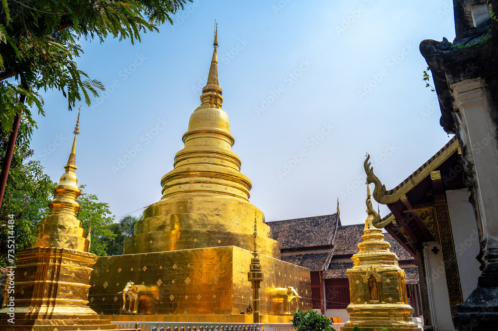 Naklejka premium View of a golden stupa in Wat Phra Singh in the center of Chiang Mai