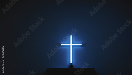 Blue neon illuminated cross in a dark room