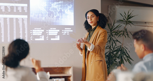 Projector, presentation report and business woman answer employee engagement on globalization stats, chart or graph. Audience question, worldwide data or leader mentoring agent on world economy forum photo