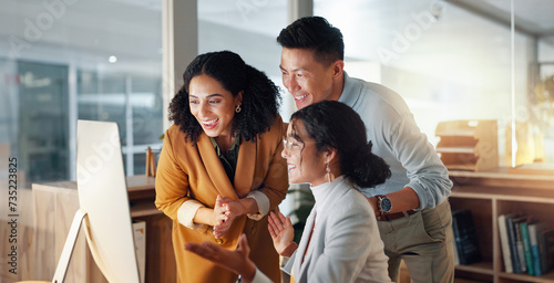 Business, people and celebrate for teamwork success, support and collaboration with computer in office. Celebration, man and women happy together with pride or congratulations for work feedback