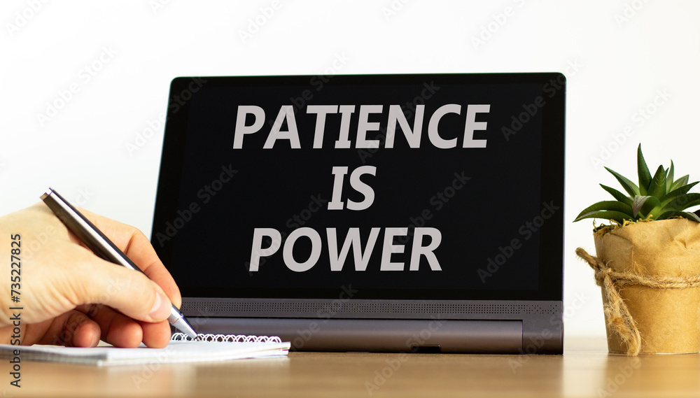 Patience is power symbol. Concept words Patience is power on beautiful tablet screen. Beautiful wooden table white background. Businessman hand. Business and patience is power concept. Copy space. Patience is power symbol. Concept words Patience is power on beautiful tablet screen. Beautiful wooden table white background. Businessman hand. Business and patience is power concept. Copy space.