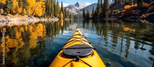 Kayak on alpine lake in fall © Dzikir