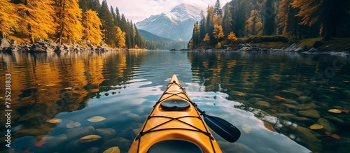 Kayak on alpine lake in fall