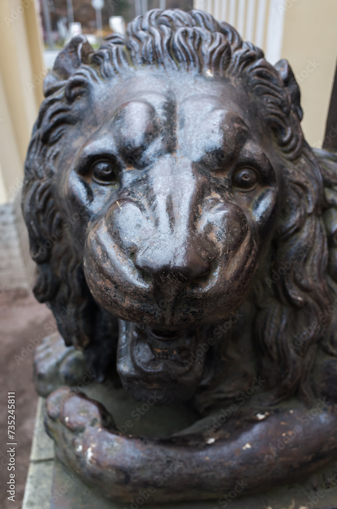 Lion head. Ancient sculpture, former pillar base of the Gothic guardhouse