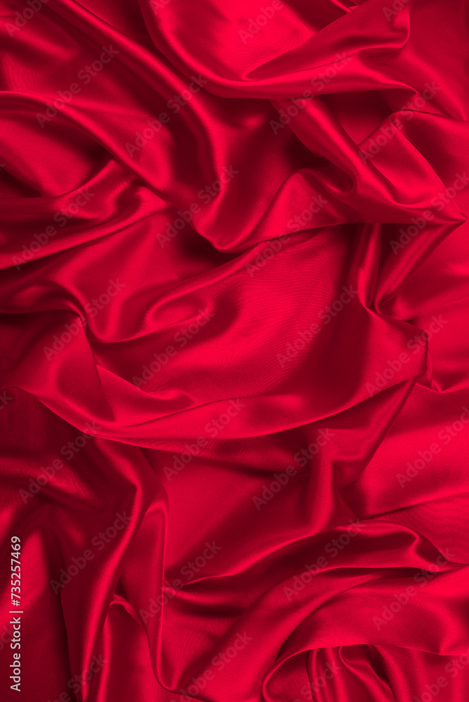 Red silk or satin luxury fabric texture can use as abstract background. Top view. Red silk or satin luxury fabric texture can use as abstract background. Top view.
