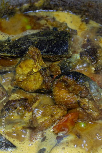 fresh cooked boiling fish gravy at cauldron at home at day