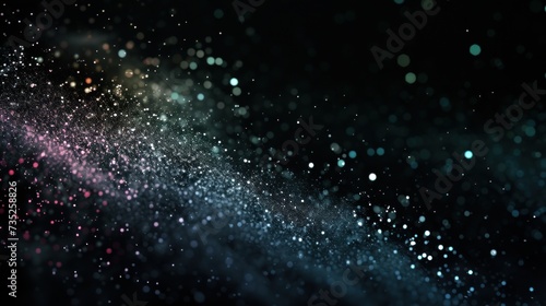 iridescent glitter particles on black background