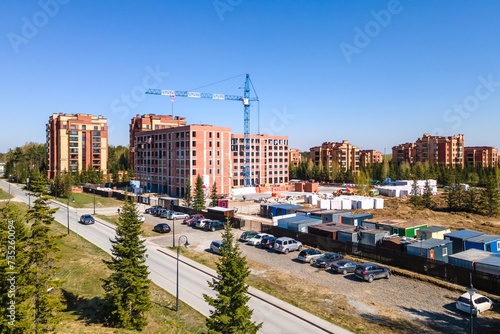 Photography the construction site of an apartment building in the summer from a height