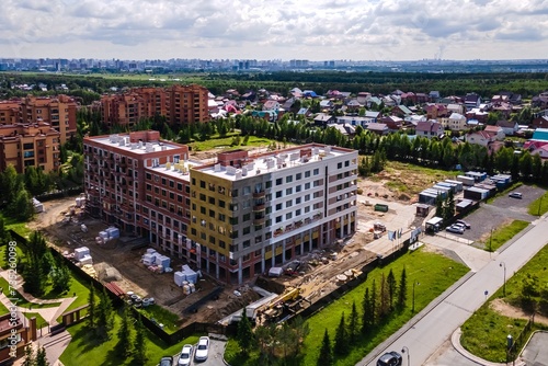 Photography the construction site of an apartment building in the summer from a height