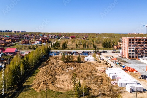 Photography the construction site of an apartment building in the summer from a height