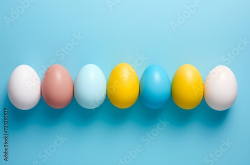 colorful easter eggs arranged on a blue background easter egg