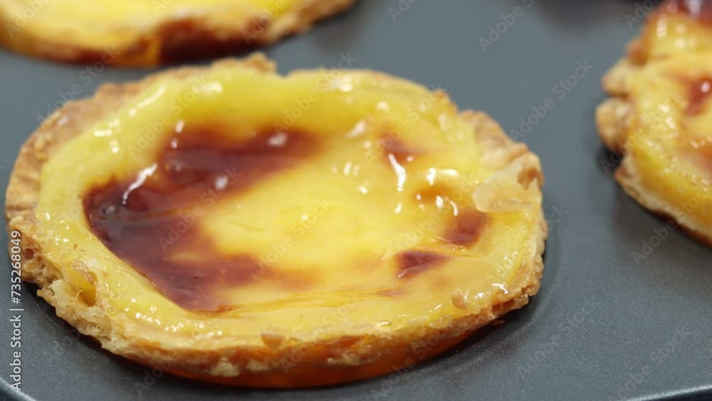 Creating and preparing pies from crispy puff pastry with egg custard in special baking dishes. Traditional Portuguese dessert Pastel de Nata or Pastel de Belem. Cake, a national delicacy. Creating and preparing pies from crispy puff pastry with egg custard in special baking dishes. Traditional Portuguese dessert Pastel de Nata or Pastel de Belem. Cake, a national delicacy.
