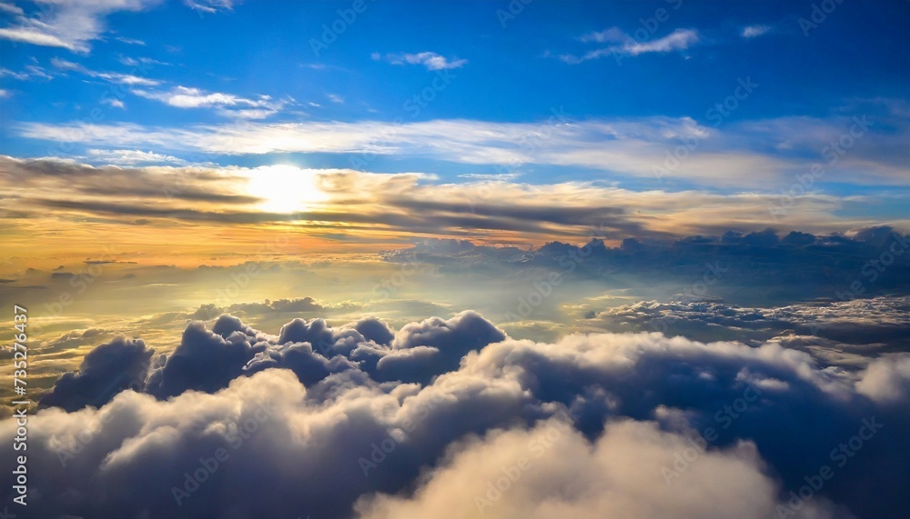 Beautiful aerial view above clouds at sunset. Cloudscape with blue sky. Beautiful aerial view above clouds at sunset. Cloudscape with blue sky.
