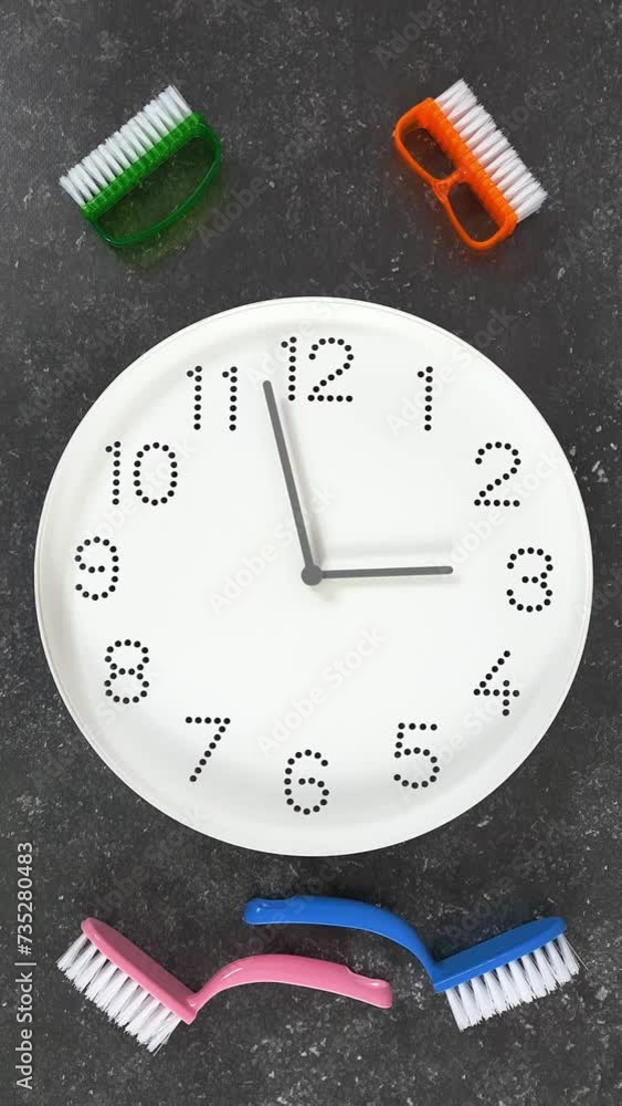 Cleaning time. 3 o'clock. White clock face on dark background with ...