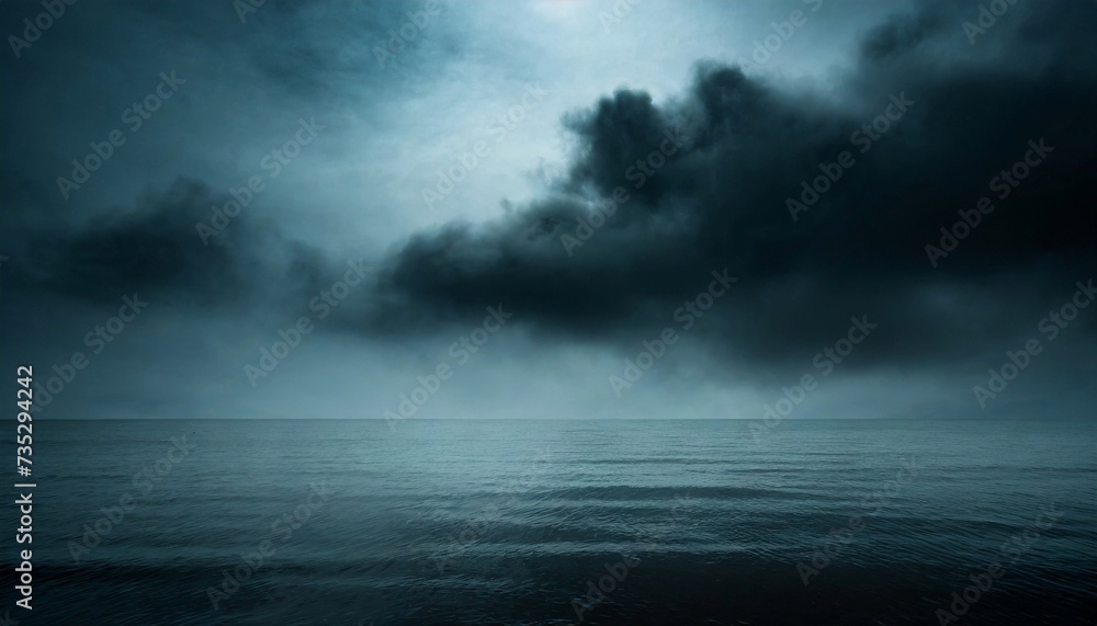 Seascape with dark blue sky and dramatic clouds. Night ocean. Gloomy weather.