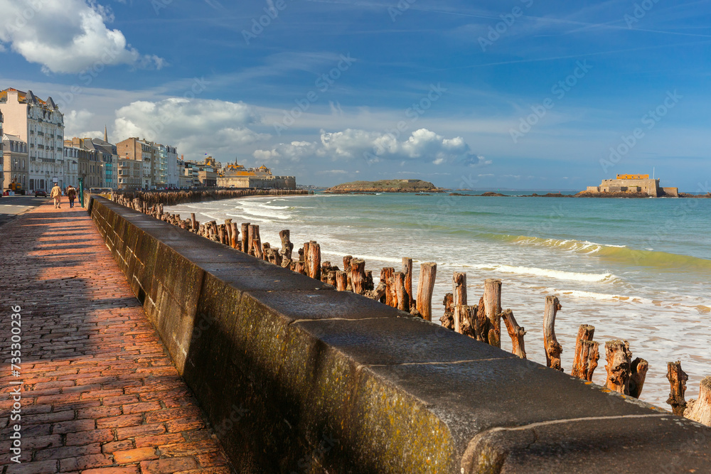Sunny aerial view of beautiful walled port city of Saint-Malo at high tide, Brittany, France - obrazy, fototapety, plakaty 
