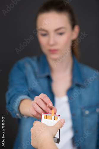 a woman taking a cigarette photo