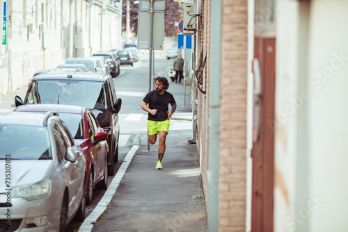 Man jogging in urban street setting