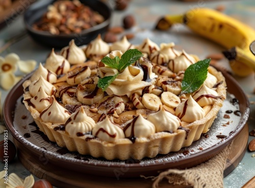 a dessert sitting on top of a table next to a banana peel and a cup of coffee on top of a table.