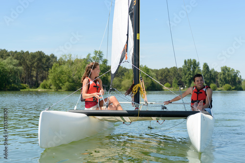 a young couple is sailing