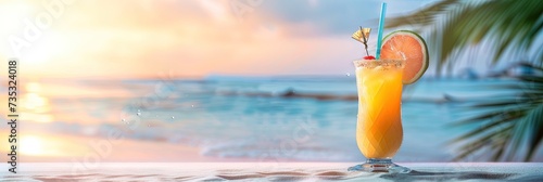 Tropical fruity cocktail with rum or tequila on a deserted island beach