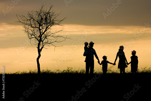 A Happy family silhouette on nature in park background