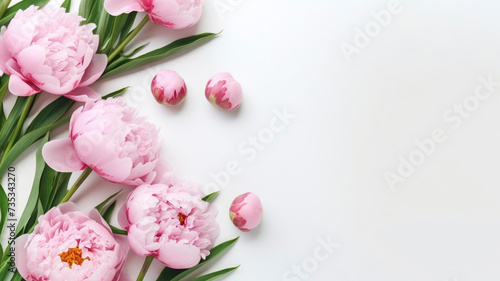 composition of a bouquet of pink peony flowers, top view with copy space on a white background