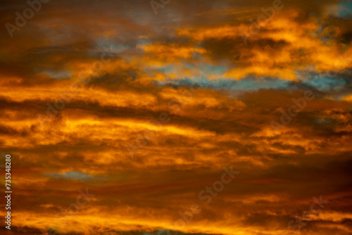 Beautiful idyllic sky at dawn with strong yellow and orange colors