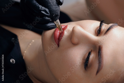 Banner Procedure woman applying permanent tattoo makeup on lips in beauty salon