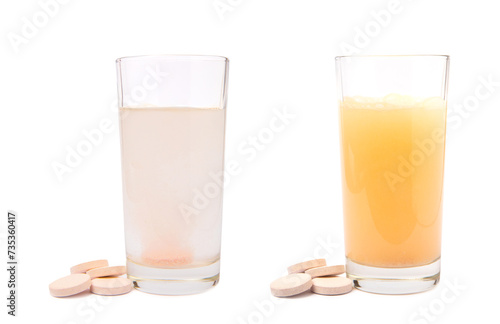 Canvas Print Vitamin C effervescent tablets with orange flavor drops and dissolves in a glass of water isolated on a white background