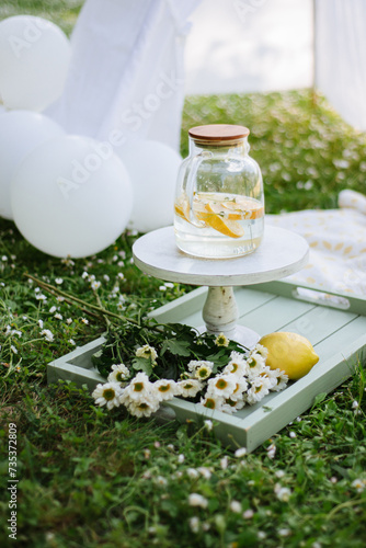 summer holiday picnic: lemonade, flowers and balloons