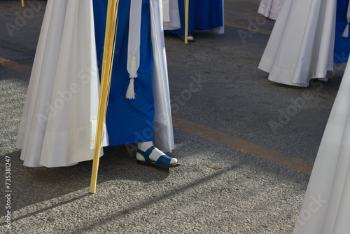 Картината върху платно Sandals of some Nazarenes in blue tunic in a Palm Sunday procession in Spain