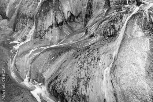 Black and white abstract art of the mineral runoff of Pinkerton Hot Spring near Durango Colorado, USA. photo