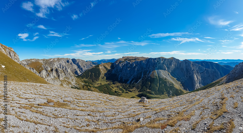 Panoramic view of majestic mountain peak Ringkamp in untamed Hochschwab mountain region, Styria, Austria. Scenic hiking trail on blue sky sunny day in remote Austrian Alps. Wanderlust in alpine spring Panoramic view of majestic mountain peak Ringkamp in untamed Hochschwab mountain region, Styria, Austria. Scenic hiking trail on blue sky sunny day in remote Austrian Alps. Wanderlust in alpine spring