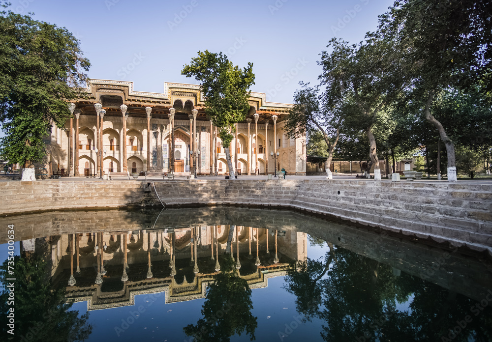 Exterior of the Bolo-Hauz Mosque in the ancient city of Bukhara in Uzbekistan, oriental architecture at dawn in the morning Bolohovuz masjidi