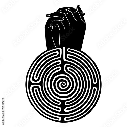 Two human hands folded in pray and a round spiral maze or labyrinth symbol. Creative concept. Black and whit silhouette.