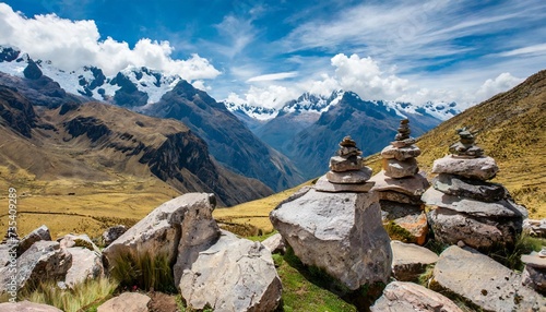 a group of rocks guide the eye towards a vast mountain range in the peruvian highlands horizontal