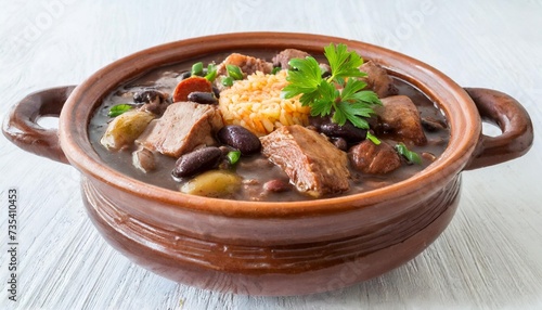 traditional pork and beef feijoada in clay pot isolated
