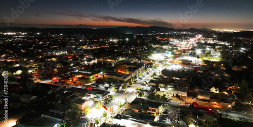 A Drone UAV of Palm Springs and Palm Desert  California  at Night with pretty city lighrs colorfully glittering