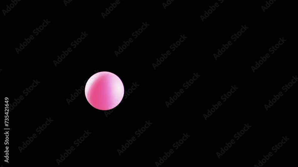 Pink Small Tennis Ball Spinning in Copy Space on Black Background. Abstract. Side view. Plastic sphere or ball balances in the air flow. levitation. Selective focus. One hovering, flying ball. Light. Pink Small Tennis Ball Spinning in Copy Space on Black Background. Abstract. Side view. Plastic sphere or ball balances in the air flow. levitation. Selective focus. One hovering, flying ball. Light.
