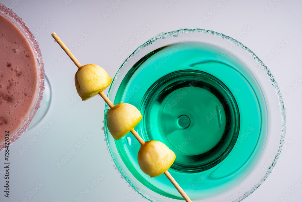 top view detail of colorful cocktails on white background top view detail of colorful cocktails on white background