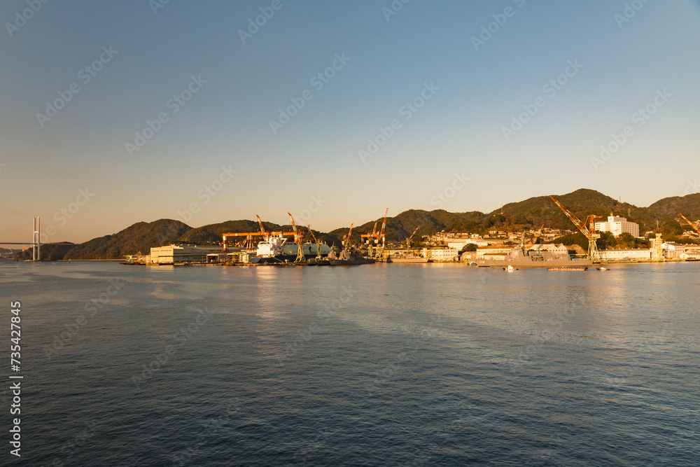 Fototapeta premium Nagasaki Bay, Nagasaki, Japan on a clear early morning with golden light