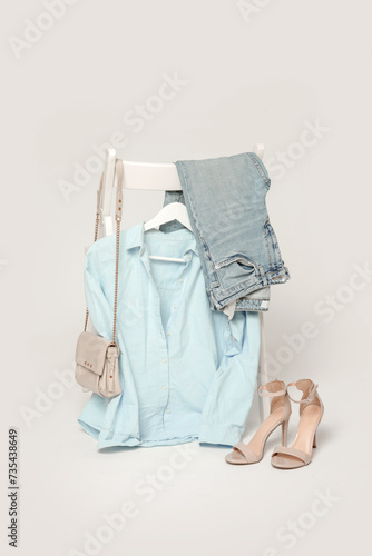 Clothes on a chair. Product photography, fashion still life. Spring summer outfits.	