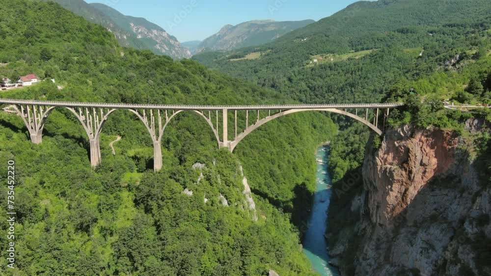 Aerial tilt view on Djurdjevica arch bridge over the Tara River in northern Montenegro, 4k Aerial tilt view on Djurdjevica arch bridge over the Tara River in northern Montenegro, 4k